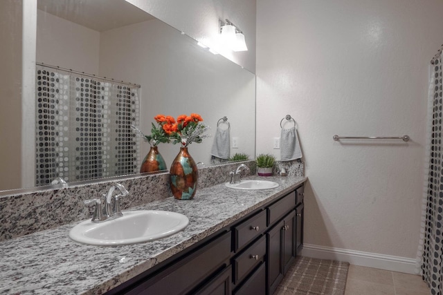 bathroom with vanity and tile patterned floors