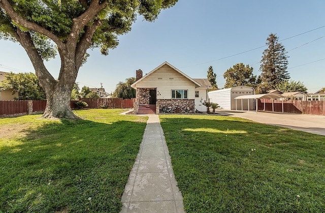 view of front of property featuring a storage shed, a patio, and a front yard