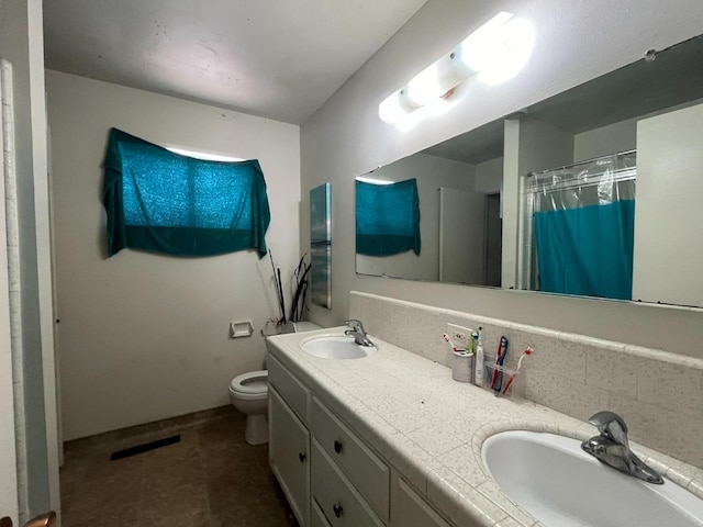 bathroom featuring vanity, tasteful backsplash, tile patterned flooring, toilet, and a shower with curtain