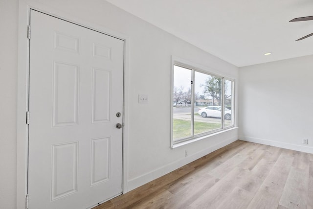 foyer featuring ceiling fan and light wood-type flooring