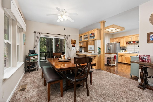 dining area with ceiling fan and hardwood / wood-style flooring