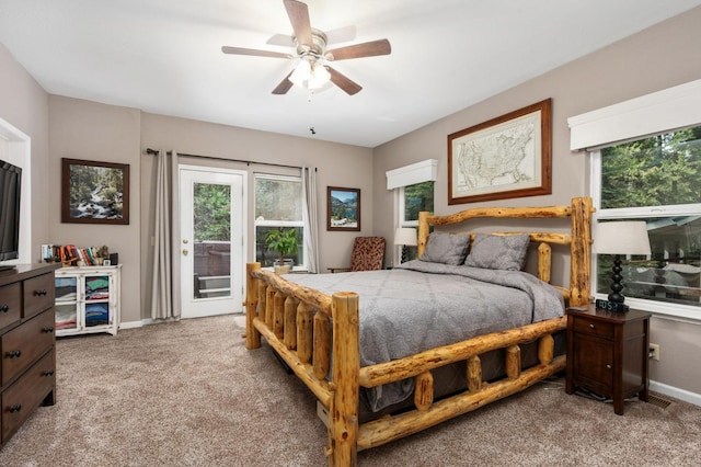 carpeted bedroom featuring ceiling fan and access to exterior