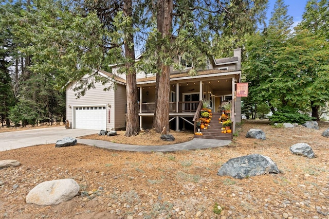 view of front of house featuring a garage and a porch