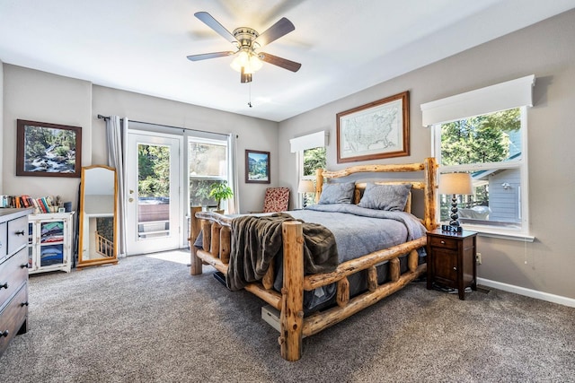 carpeted bedroom featuring access to outside, multiple windows, and ceiling fan