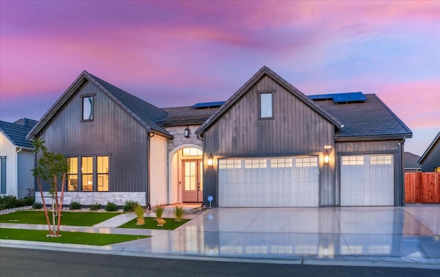 modern farmhouse style home with a garage