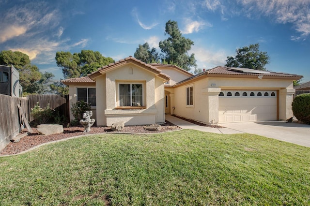 mediterranean / spanish-style house with a front yard and a garage