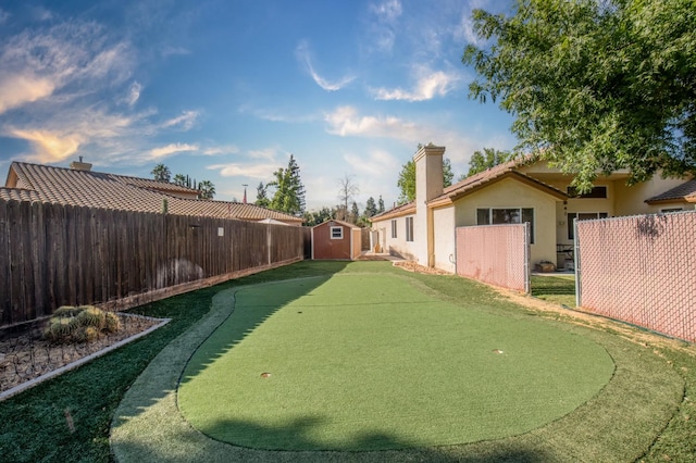 view of yard featuring a storage unit