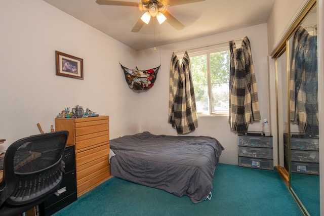 carpeted bedroom with ceiling fan and a closet