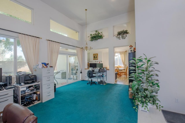 office space with carpet floors and a towering ceiling