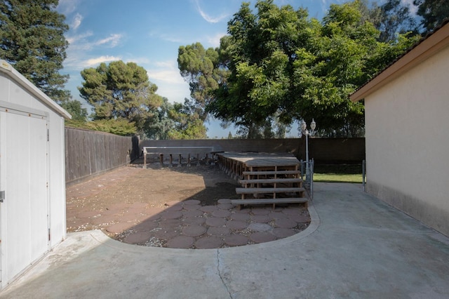 view of patio featuring a storage shed