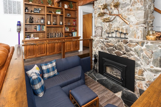 living room with a fireplace and dark hardwood / wood-style flooring