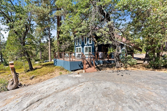 view of front of property featuring a wooden deck