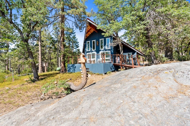 view of front of home featuring a wooden deck