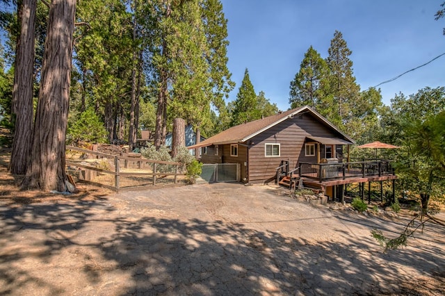 view of front of house featuring a wooden deck