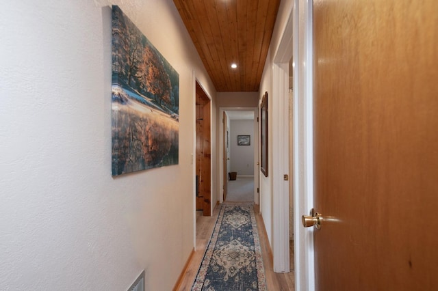 hall featuring wood ceiling