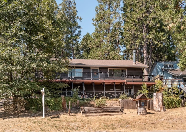 rear view of property with a deck