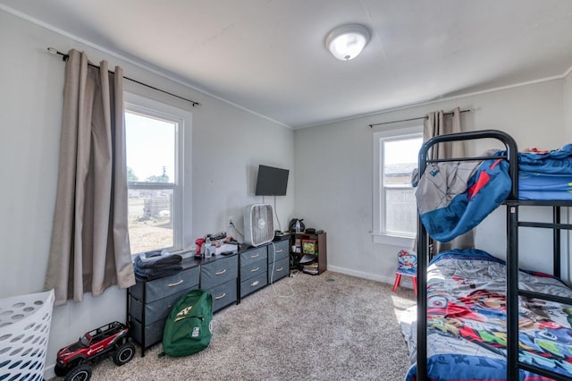 carpeted bedroom featuring crown molding