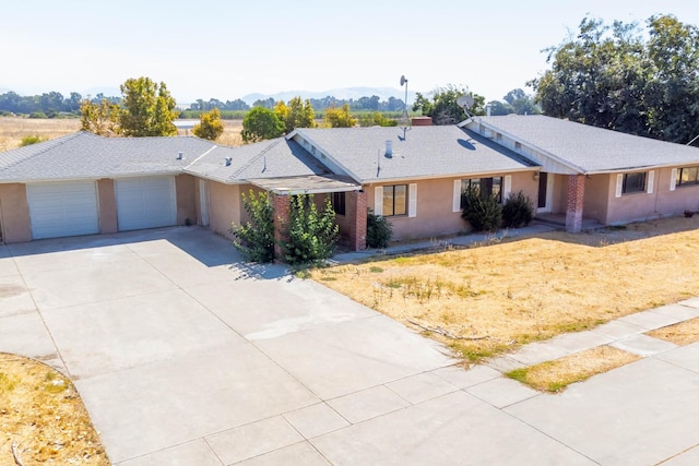 ranch-style house featuring a garage