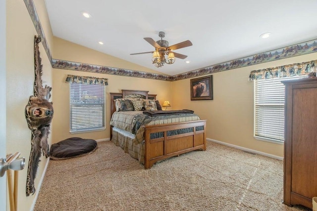 carpeted bedroom with vaulted ceiling, multiple windows, and ceiling fan