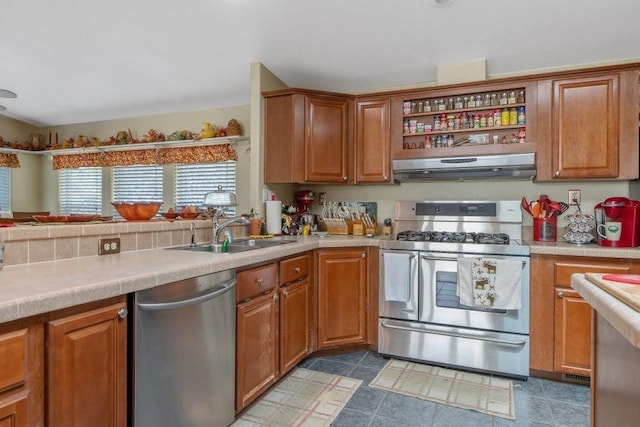 kitchen featuring a sink, brown cabinets, appliances with stainless steel finishes, and extractor fan