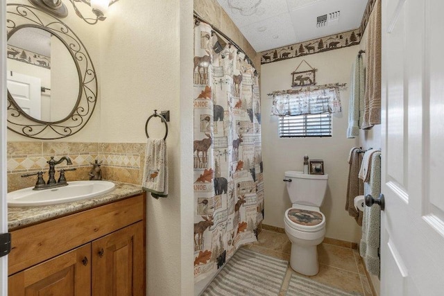 bathroom featuring tile patterned flooring, backsplash, toilet, a shower with curtain, and vanity