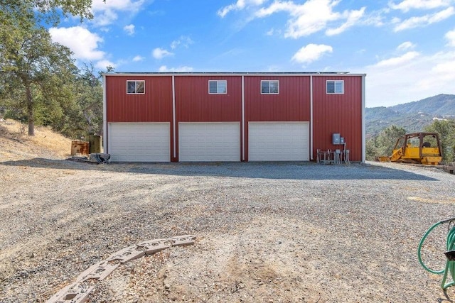 detached garage featuring a mountain view