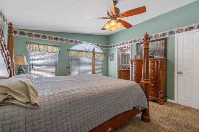 carpeted bedroom featuring lofted ceiling and ceiling fan