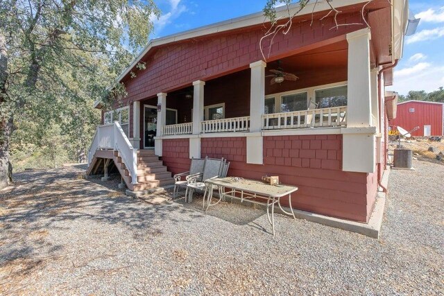 view of side of home featuring a patio, ceiling fan, and central air condition unit