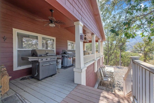 wooden terrace with a grill and ceiling fan