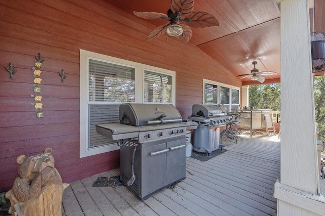 wooden deck with a grill and ceiling fan