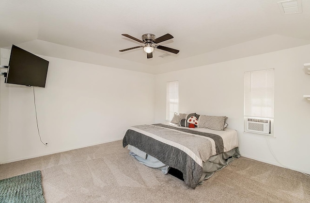 bedroom with cooling unit, carpet floors, and ceiling fan