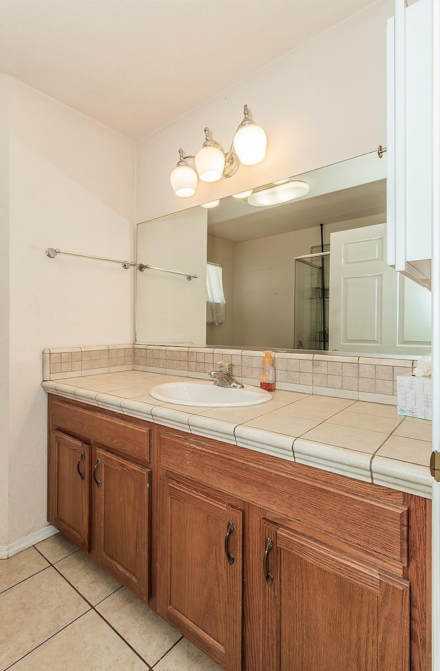 bathroom featuring vanity and tile patterned flooring