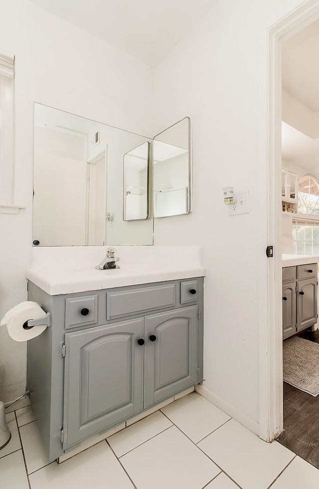 bathroom featuring tile patterned flooring and vanity