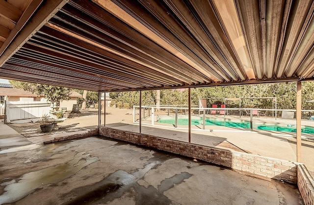 view of patio / terrace with a fenced in pool