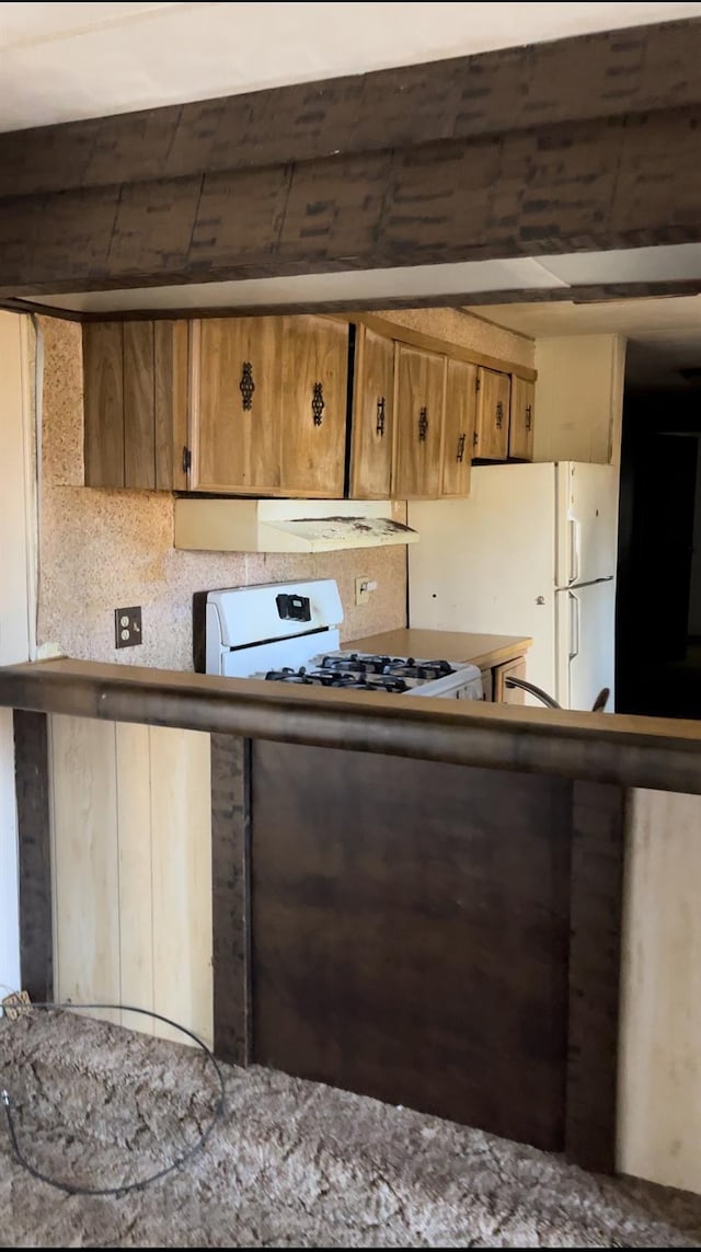 kitchen featuring white appliances and decorative backsplash