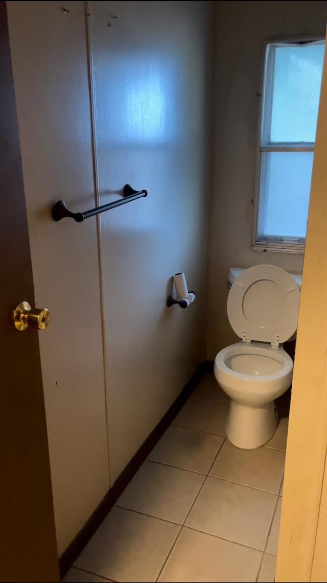 bathroom featuring tile patterned flooring and toilet