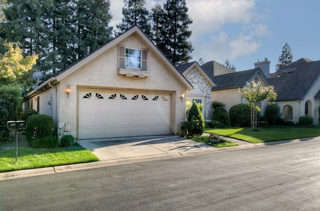 view of front of house featuring a front lawn and a garage