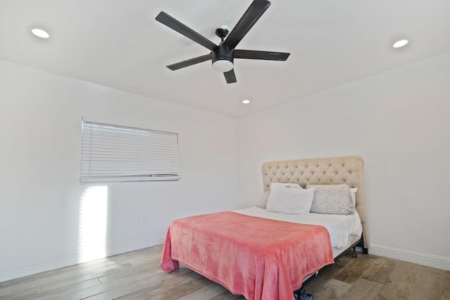 bedroom with hardwood / wood-style flooring and ceiling fan