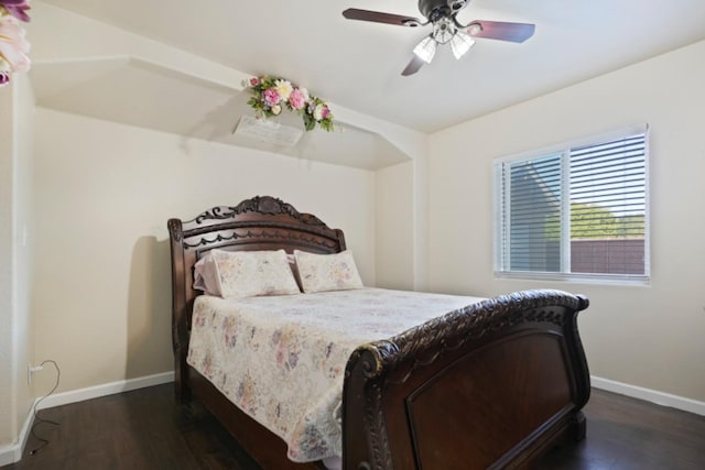 bedroom with dark wood-type flooring and ceiling fan