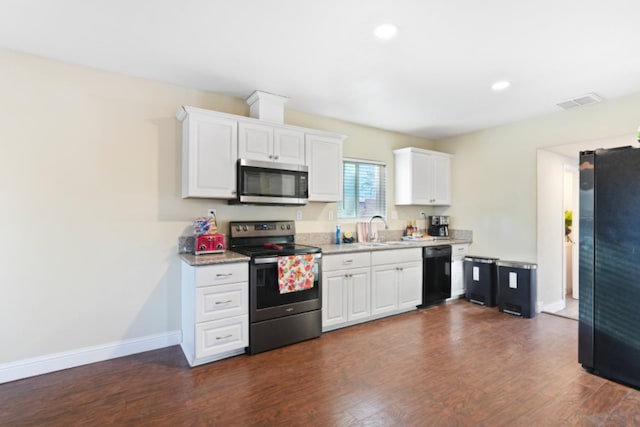 kitchen with white cabinets, dark hardwood / wood-style floors, sink, and black appliances