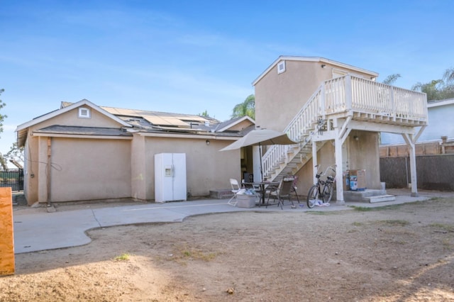 back of property with a patio area