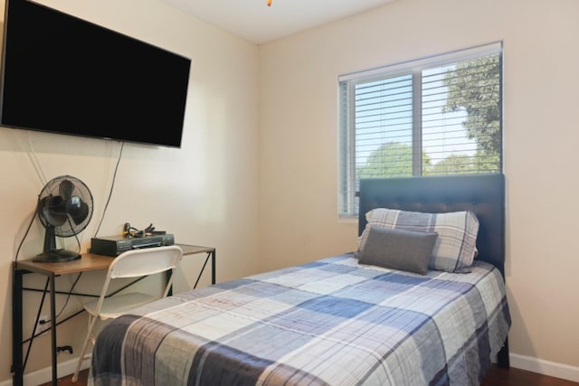 bedroom with hardwood / wood-style floors