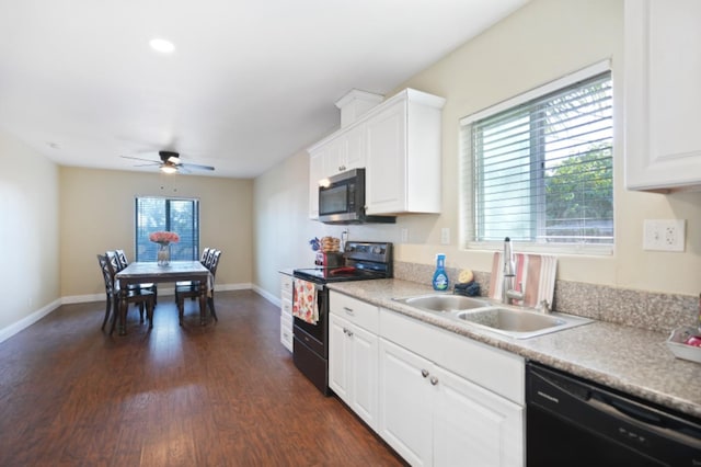 kitchen featuring black appliances, white cabinetry, a wealth of natural light, and sink