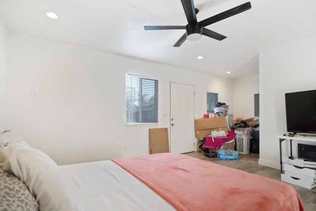 bedroom featuring light hardwood / wood-style floors and ceiling fan