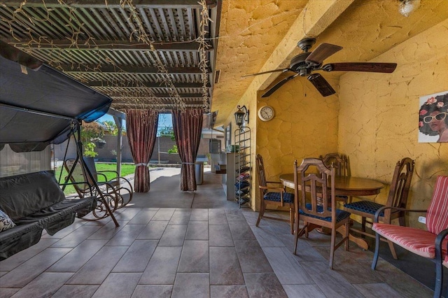 view of patio / terrace featuring ceiling fan