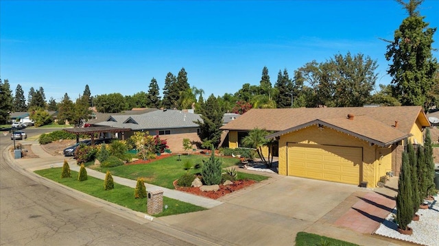 view of front of house with a garage and a front lawn