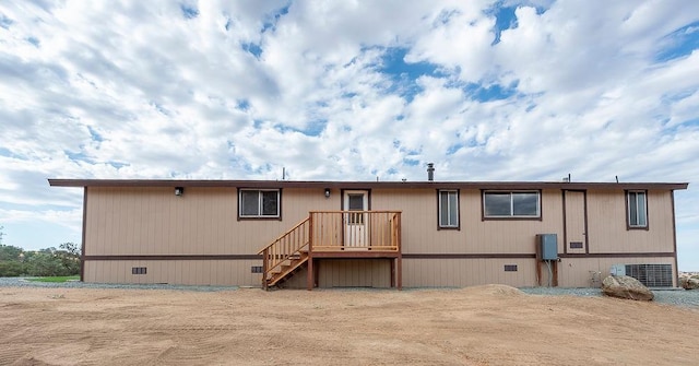 view of front of property featuring crawl space and central AC