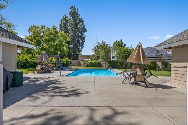 view of swimming pool with a patio