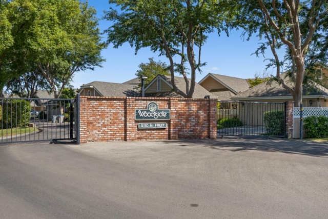 view of gate featuring a garage