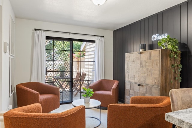 sitting room with wood walls